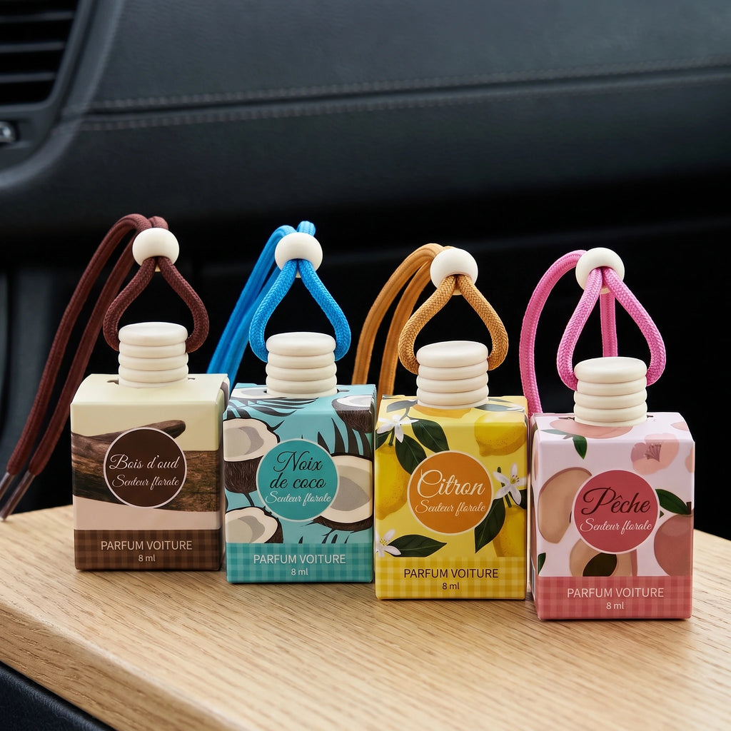 Les quatre senteurs du parfum voiture suspendu : Bois d’oud, Noix de coco, Citron et Pêche