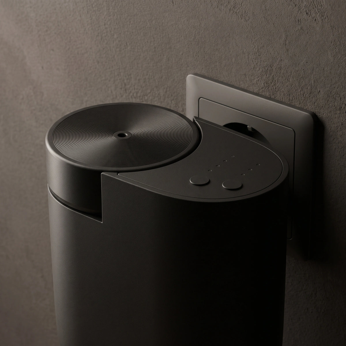 Gros plan sur le diffuseur mural noir et ses commandes